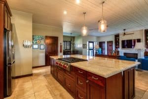 pendant light hanging over marble kitchen island