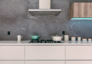 concrete backsplash extending to ceiling