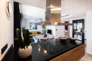 black countertop below steel range hood