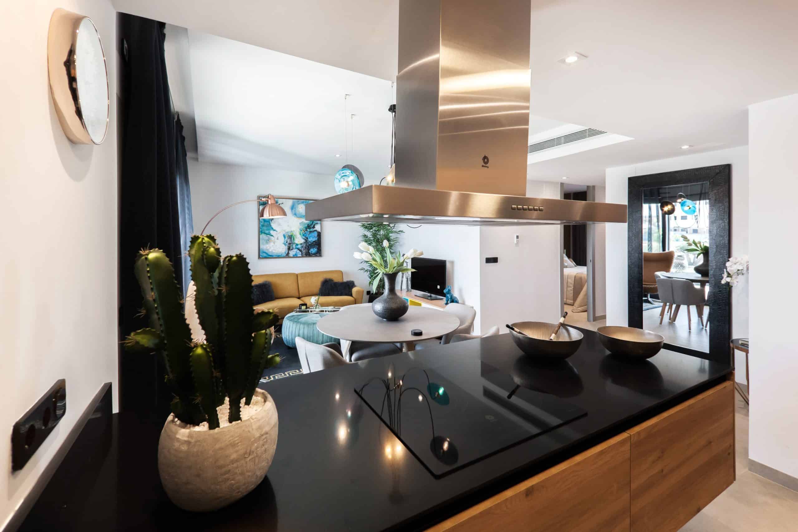 black countertop below steel range hood