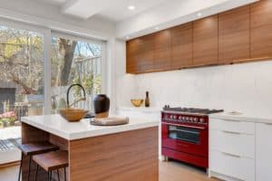 kitchen with white walls and walnut cabinets