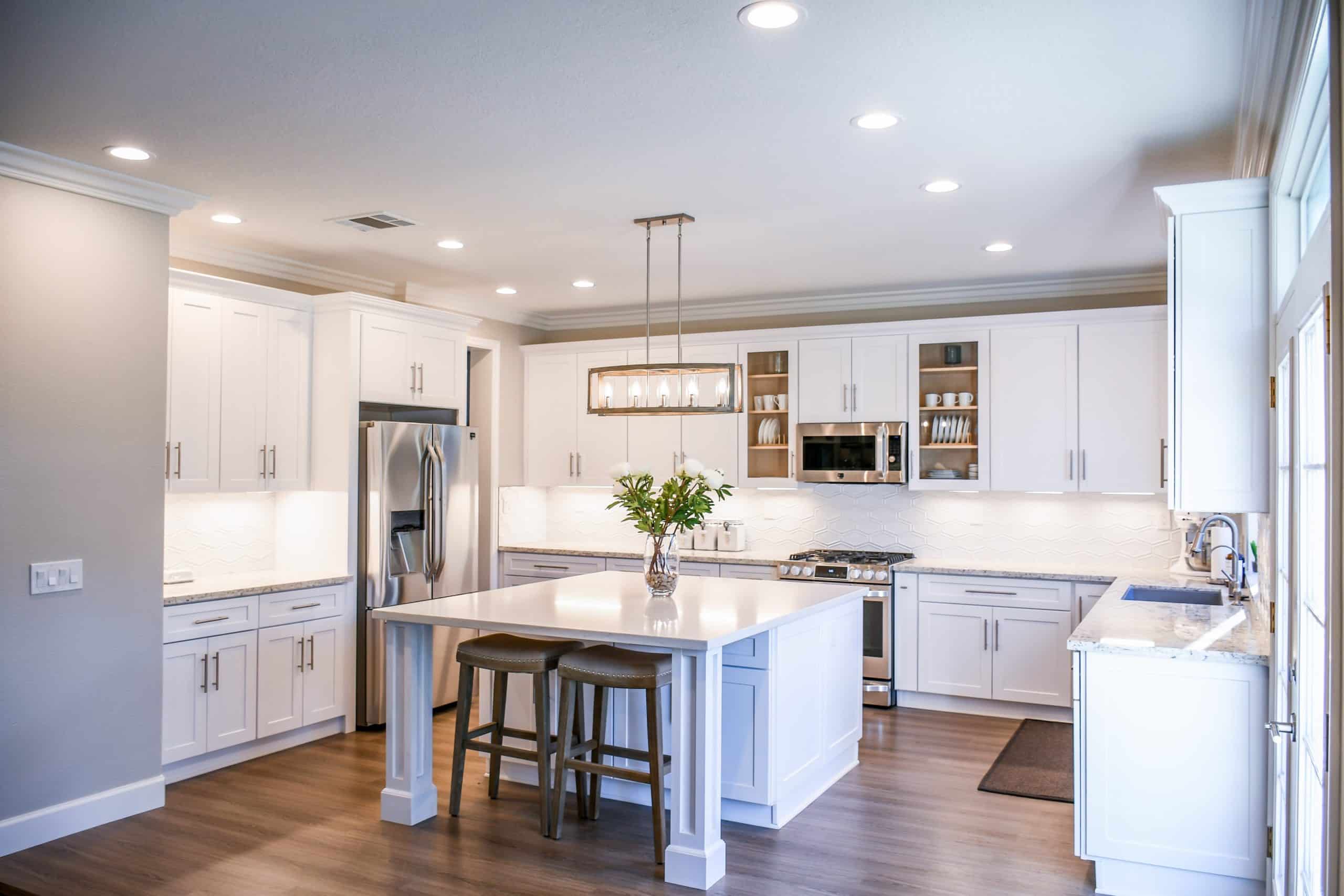 kitchen with wood flooring and white theme