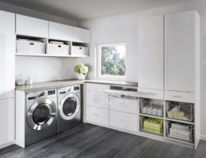 laundry room white dark wood floors and white cabinets