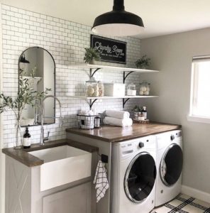 laundry room with penny tile walls