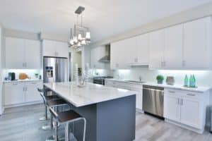 cabinet lights against white backsplash