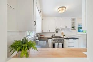 kitchen with white walls and cabinets