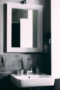 white medicine cabinet with mirror