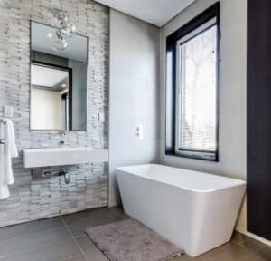 mirror medicine cabinet against tiled backsplash