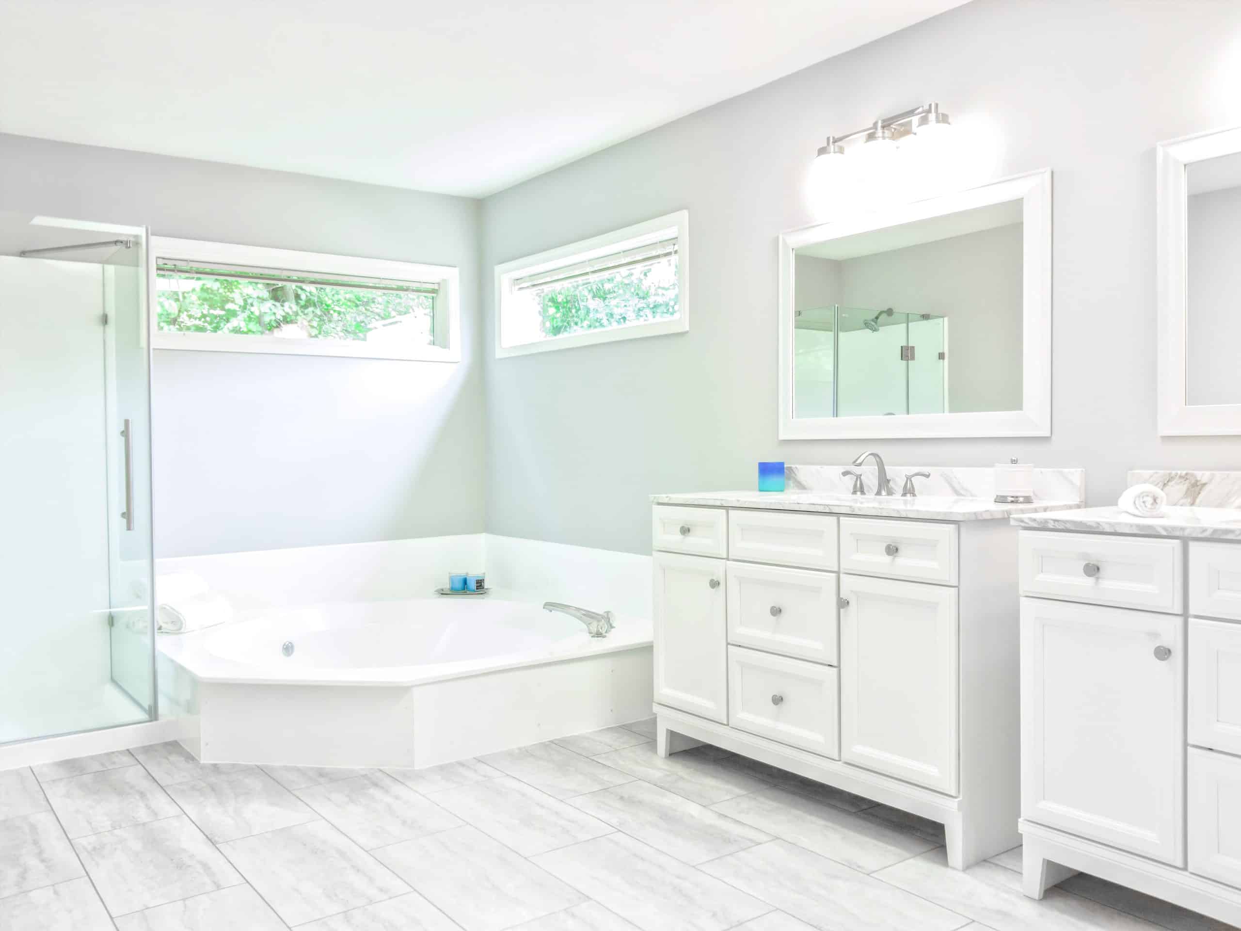 mirrored medicine cabinet above white bathroom vanity